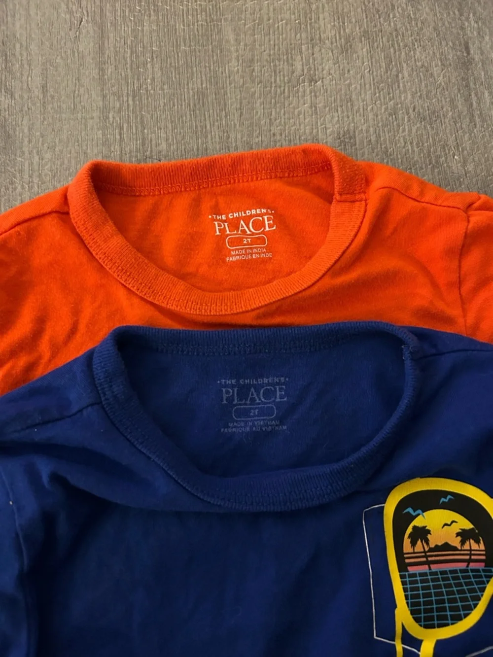 The Children's Place Orange and Blue Graphic Tee Set. (2 shirts)